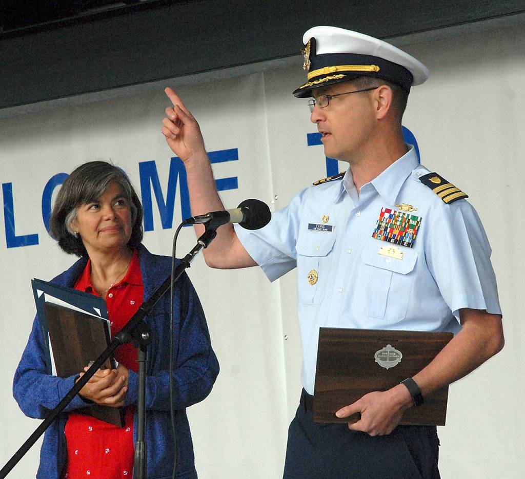 U.S. Coast Guard Cmdr. Thomas Evans of the Maritime Force Protection Unit Bangor speaks after receiving a welcoming proclamation from Port Angeles Mayor Sissi Bruch. (Keith Thorpe/Peninsula Daily News)