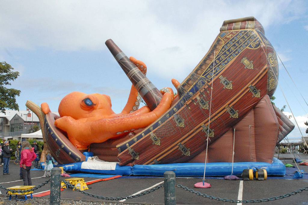 A giant inflatable slide known as The Kraken entertains youngsters in the parking lot at Port Angeles City Pier on Saturday. (Keith Thorpe/Peninsula Daily News)