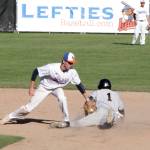 Lefties second baseman Brady Heid puts the tag on Cowlitzs Kyle Froemlie in Mondays game. Froemlie was called safe. (Dave Logan/for Peninsula Daily News)