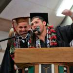 Benjamin Greene and Daniel Kilmer present a speech on the Makah flag during the Neah Bay High School graduation Saturday at the school gym. (Marla Tolliver)