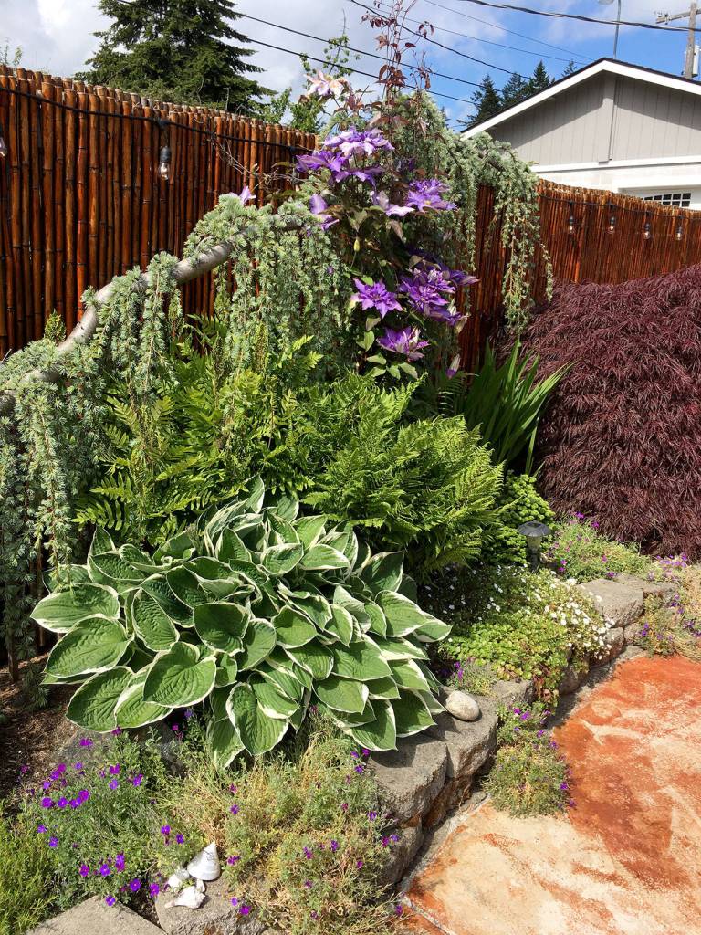 The Pendegraph gardens are one of six Port Angeles area gardens on display at the Petals and Pathways Home Garden Tour on Saturday.