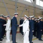 Capt. Mark Hiigel (left), former commanding officer of Coast Guard Air Station/Sector Field Office Port Angeles, and new commanding officer Cmdr. M. Scott Jackson (center) greet members of the air station during a change of command ceremony Friday. Jackson became the 42nd commanding officer of the Coast Guard base on Ediz Hook. (Rob Ollikainen/Peninsula Daily News)