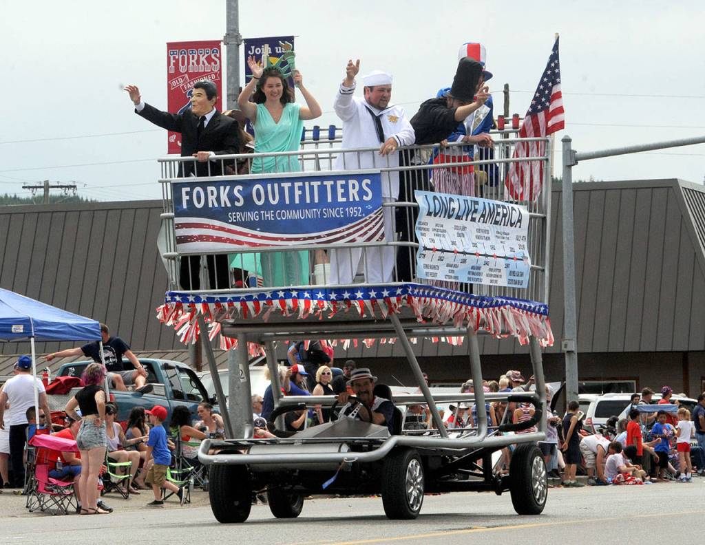 The Forks Outfitters store entered its large grocery cart honoring the United States in the grand parade. (Lonnie Archibald/ for Peninsula Daily News)