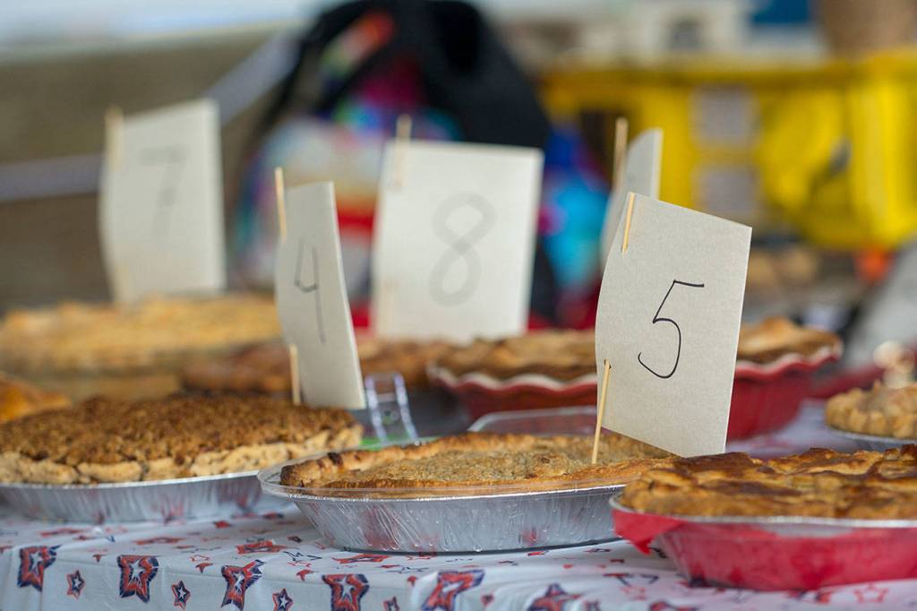 Pies entered into the Apple Bie Baking Contest on Wednesday wait to be sampled by judges. (Jesse Major/Peninsula Daily News)