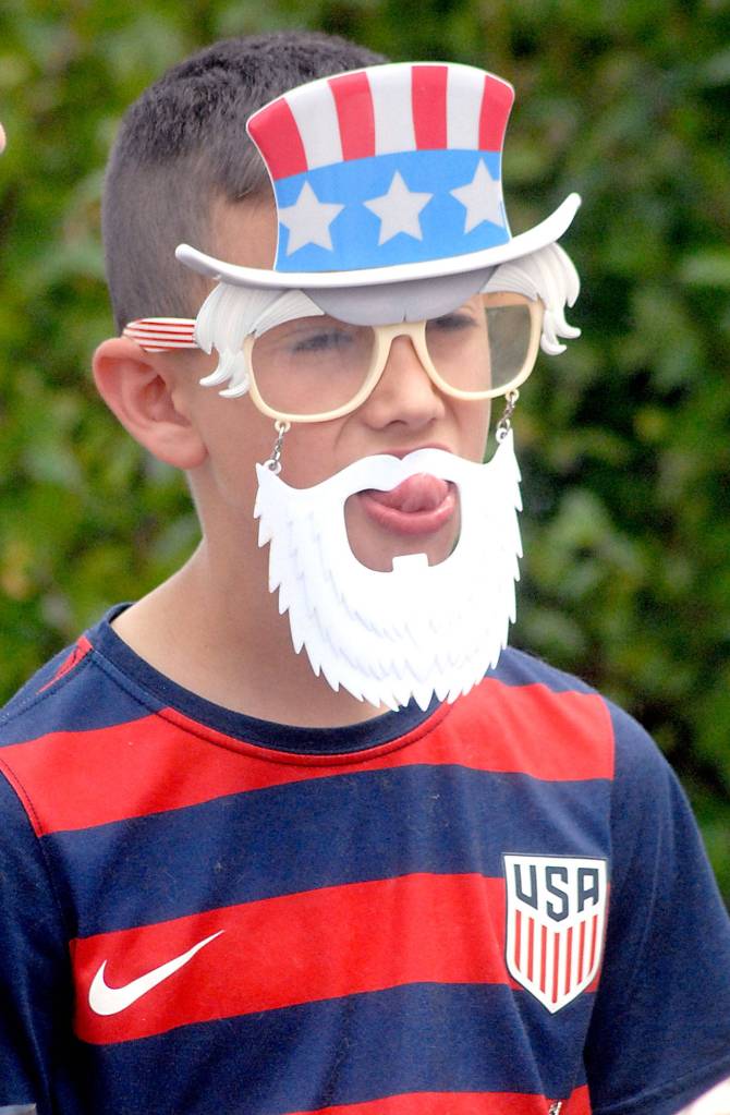Bryce DeLeon, 11, of Port Angeles wears Uncle Sam sunglasses at Port Angeles City Pier on Independence Day. The citys waterfront was a focus of numerous activities in celebration of the Fourth of July. (Keith Thorpe/Peninsula Daily News)