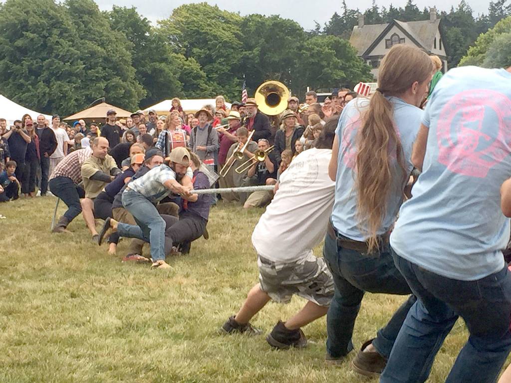 Cheered on by the crowd and music, teams took part in a tug-o-war competition in Port Townsends Old School 4th of July at Fort Worden. (Jen Clark)