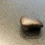 An ordinary chondrite meteorite is shown. Scientists believe meteorites were formed during the birth of the inner solar system about 4.5 billion years ago. (Rob Ollikainen/Peninsula Daily News)