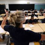 Teacher Zara Gibbon gestures while teaching a group of incoming sixth-graders at Animo Westside Charter Middle School during a summer session to introduce new students to the school they will attend in the fall in the Playa Del Rey area of Los Angeles. (Reed Saxon/The Associated Press)