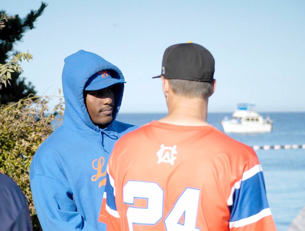 Port Angeles Ron Brown, left, and Corvallis Cody Hawken talk before the beginning of the West Coast League home run derby. As it turned out, Brown and Hawken would go 1-2 in the derby. (Pierre LaBossiere/Peninsula Daily News)