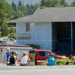 A group of residents of Wildwood Terrace Apartments, 934 W. Lauridsen Blvd., wait along the street after a propane gas leak forced the evacuation of about 40 people on Tuesday afternoon in Port Angeles. (Keith Thorpe/Peninsula Daily News)