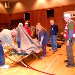 Volunteers with the Red Cross of Kitsap and Olympic Peninsulas help a trainee during a recent Shelter Training event. The local chapter in Carlsborg recently consolidated into one suite and volunteers seek space to store resources across Clallam County. (Deb Wozniak)