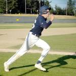 Wilder Junior baserunner Mason Nickovich rounds third base to score a run against Ridge AA. Wilder Junior went on to score 20 runs in its victory. (Pierre LaBossiere/Peninsula Daily News)