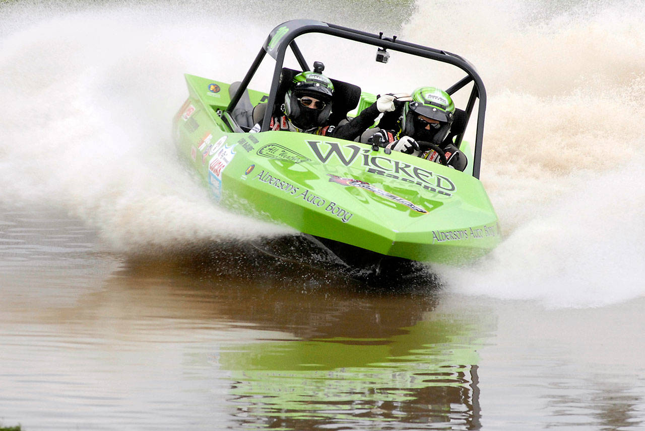 Keith Thorpe/Peninsula Daily News Dan Morrison and Cara McGuire racing at the Extreme Sports Park in September 2016.