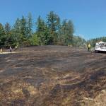 A brush fire burned near the intersection of Center Valley Road and Egg & I Road in Chimacum before being extinguished Tuesday afternoon.