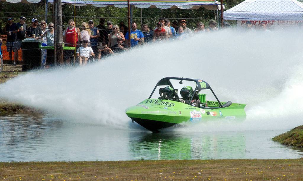 Keith Thorpe/Peninsula Daily News The Port Angeles-based Wicked Racing team of driver Dan Morrison and navigator Cara McGuire fly through the course on a qualifiying race on Saturday at the Extreme Sports Park in Port Angeles.