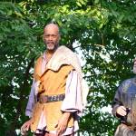 King Claudius (Brace Evans), center, and Polonius (Lawrie Driscoll) arrive in Port Townsends Chetzemoka Park for Hamlet. (Diane Urbani de la Paz/for Peninsula Daily News)