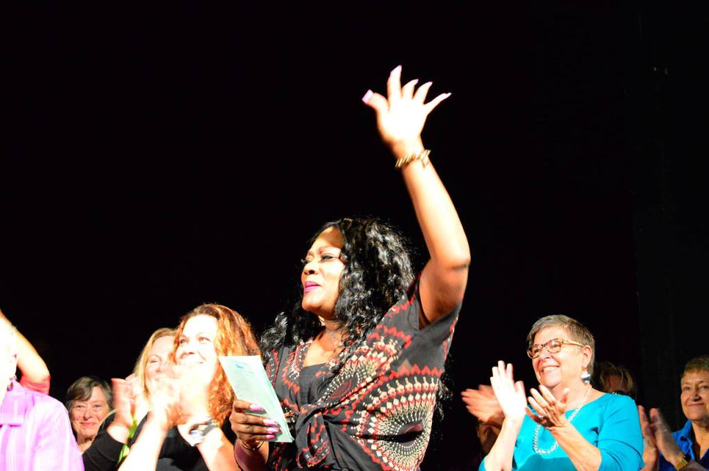 Tawana Cunningham of Memphis, Tenn., was among the teachers of the Acoustic Blues Festivals gospel singing workshop at Fort Worden State Park. Cunninghams father, the Rev. John Wilkins, led his band and the newly formed choir through their performance Saturday morning  and started a little early, with sing-alongs of Jesus on the Mainline and This Little Light of Mine, since the theater was full well before show time. (Diane Urbani de la Paz/for Peninsula Daily News)