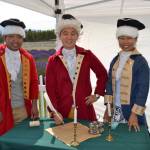 Friends from Seattle, from left, Peter Cher, Jung Jim and Jin Lim dress the part for a photo-op as they prepare to sign the Declaration of Independence at the 2017 Northwest Colonial Festival. Visitors also can dress in colonial clothes at this years event this weekend. (Matthew Nash/Olympic Peninsula News Group)