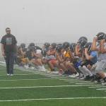 Lonnie Archibald/for Peninsula Daily News Forks football players warm up during their first of two practices Wednesday, the opening day of the prep football season.