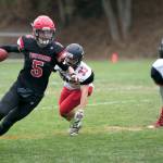 Steve Mullensky/for Peninsula Daily News Port Townsends Noa Apker-Montoya, left, is the Redhawks returning starter at quarterback. He also has 18 interceptions in his first two seasons defensively.