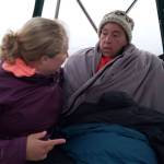 In this photo from Twitter, Susan Simmons, right, chats with a member of her team after halting her swim across the Strait of Juan de Fuca on Saturday evening. Simmons started to develop hypothermia after swimming for almost nine hours.