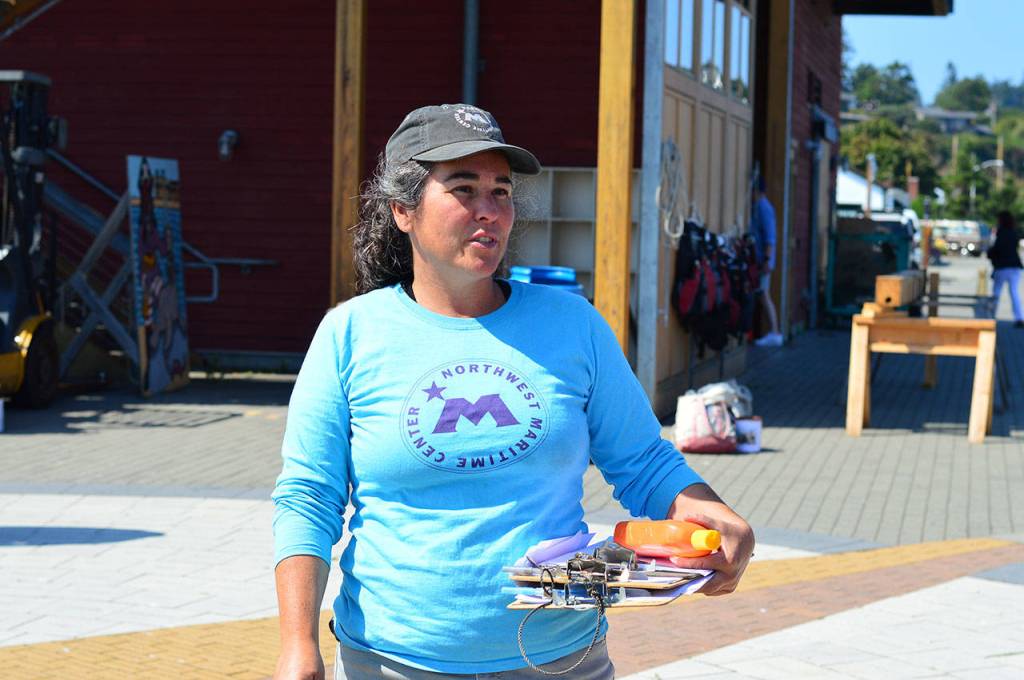 Alicia Dominguez briefs the newly formed Team Longboat in Port Townsend on Friday. (Diane Urbani de la Paz/for Peninsula Daily News)