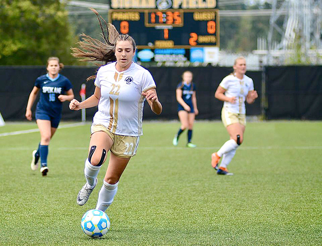 Jay Cline                                Peninsulas Sam Guzman dribbles upfield during the Pirates 2-0 win over Spokane on Saturday at Wally Sigmar Field.