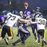 Sequims Riley Cowan (14) throws over the Forks defense while leading the Wolves back from a 16-0 deficit to win 20-16. (Michael Dashiell/Olympic Peninsula News Group)