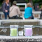 Candles sit on the edge of the fountain at Veterans Memorial Park in Port Angeles as a crowd gathers Monday for World Suicide Prevention Day. (Jesse Major/Peninsula Daily News)