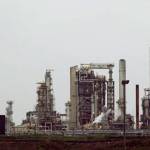 A Tesoro Corp. refinery, including a gas flare flame that is part of normal plant operations, is seen in Anacortes on April 2, 2010. (Ted S. Warren/The Associated Press)