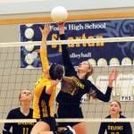 image 10=Clallam Bays Miriam Wonderly challenges Spartan Julia Lausche (2) at the net Tuesday night in Forks where the Bruins defeated Forks three out of the five matches. Looking on for the Bruins are Kaitlynn Tyree (11) and Hannah Olson (22). Lonnie.