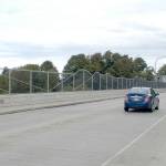 Motorists cross the eastern Eighth Street bridge Saturday, where a community block party will be held Wednesday. The program will begin at 5:30 p.m. Live bluegrass music will be played from 6 p.m. to 8 p.m. (Rob Ollikainen/Peninsula Daily News)