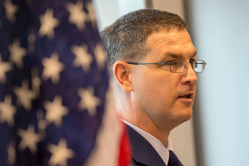 Cmdr. Thomas Evans, commanding officer of Coast Guard Maritime Force Protection Unit Bangor, speaks during the ribbon-cutting ceremony for the new Navy pier at Coast Guard Air Station/Sector Field Office Port Angeles on Friday. (Jesse Major/Peninsula Daily News)