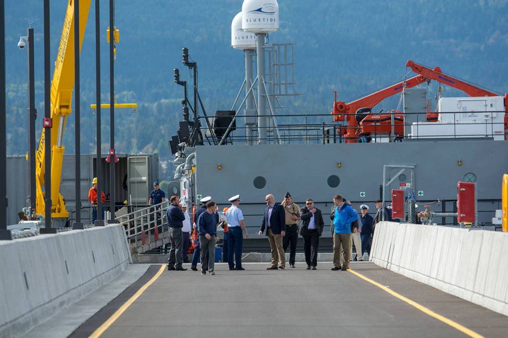 Visitors tour the new Navy pier on Friday at Coast Guard Air Station/Sector Field Office Port Angeles. (Jesse Major/Peninsula Daily News)