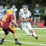 Port Angeles Brenden Roloson-Hines runs with the ball against Kingston. The Roughriders won the game 28-6 for their first win of the year. (Mark Krulish/Kitsap News Group)