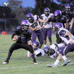 Michael Dashiell/Olympic Peninsula News Group Sequims Taig Wiker bounces outside for running room during the Wolves 16-14 win over No. 9 North Kitsap on Friday.