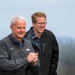 U.S. Reps. Steve Womak, left, and Derek Kilmer brave the wind at Hurricane Ridge on Sunday. Kilmer is hosting Womak, the chairman of the House Budget Committee, on a tour of his district, which includes the Olympic Peninsula. (Jesse Major/Peninsula Daily News)