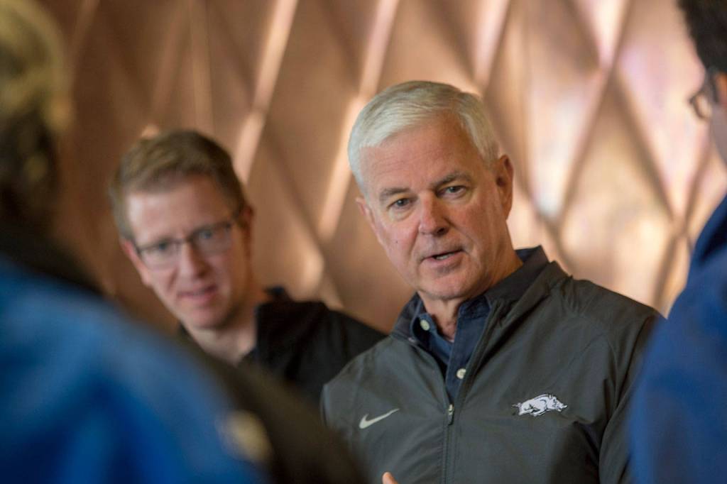 U.S. Reps. Derek Kilmer, left, and Steve Womack ask questions of people involved in the goat relocation effort at Olympic National Park during a visit to Hurricane Ridge Visitor Center on Sunday. (Jesse Major/Peninsula Daily News)