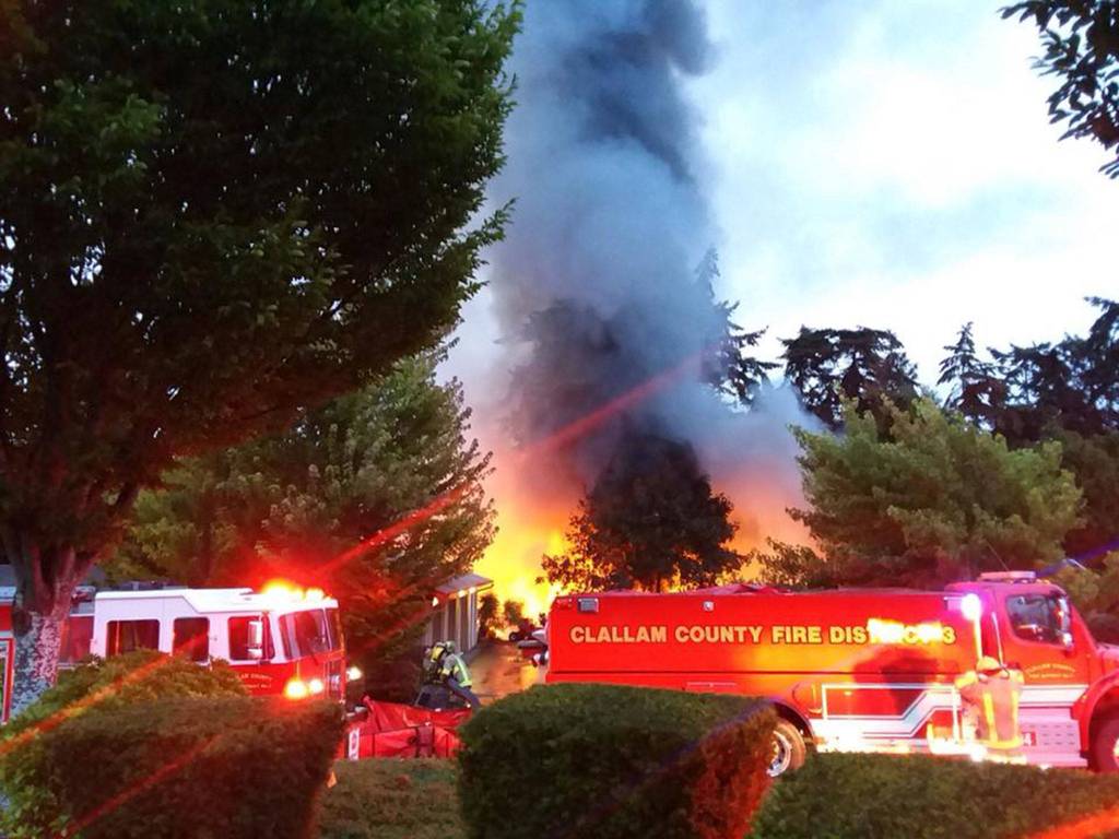 Fire crews with Clallam County Fire District 3 respond to Cedars at Dungeness early Sunday morning where an approximate 24-foot-by-100-foot building was on fire. An estimated 50 golf carts were destroyed. (Clallam County Fire District No. 3)