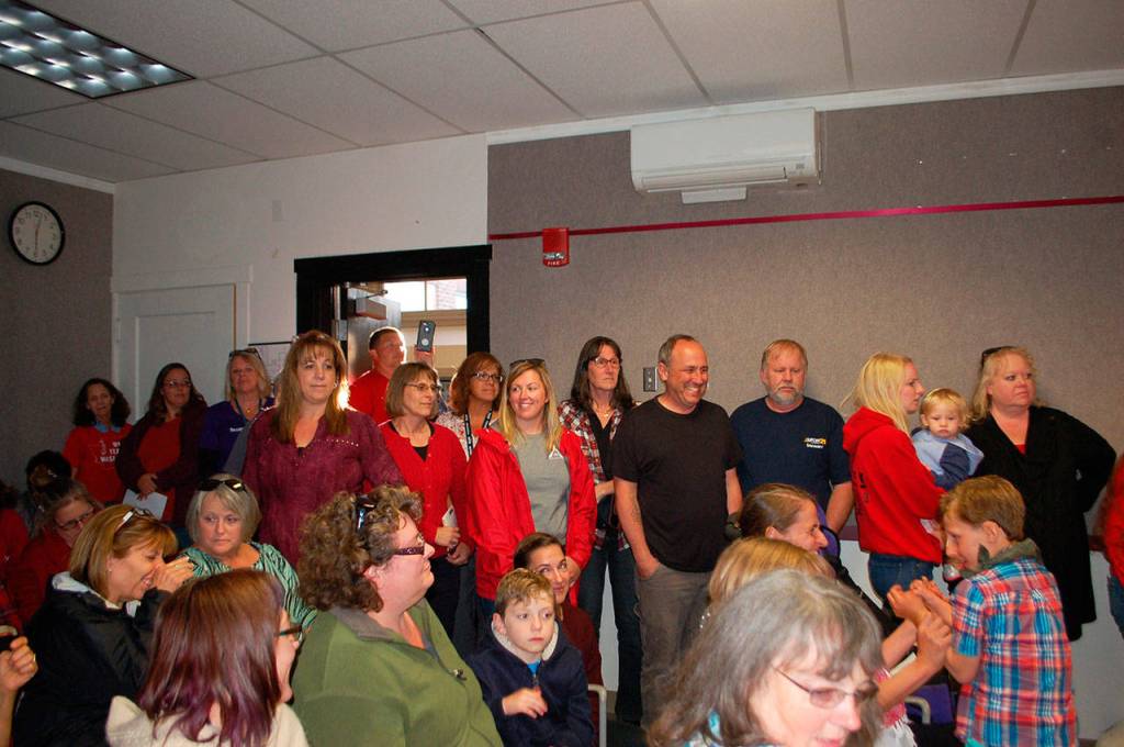 Classified staff and school board meeting attendees squeeze into a packed board room Monday as several paraeducators, parents of students and other spoke during public comments to advocate for equitable salaries for paraeducators and classified staff at Sequim School District. (Erin Hawkins/Olympic Peninsula News Group)