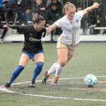 Keith Thorpe/Peninsula Daily News Edmonds Katlyn Ewoniuk, left, and Peninsulas Emilee Greve battle for the ball during Saturdays match in Port Angeles. Greve scored a goal in the match.