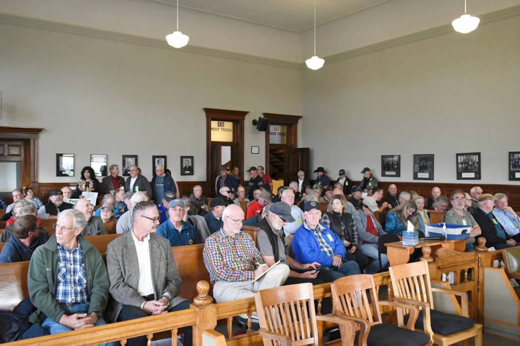 Attendees begin filling the Superior Court courtroom at the Jefferson County Courthouse at 5:30 p.m. Monday, leading to a standing room only crowd. The meeting was live-streamed to an overflow crowd seated in the District Court courtroom, the commissioners chambers and the first floor conference room. Speakers were also set up outside to broadcast the proceedings to those who could not be accommodated inside. About 325 people attended the meeting. (Jeannie McMacken/Peninsula Daily News)