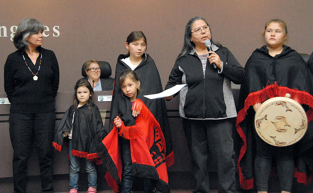 Lower Elwha Klallam Tribe Chairwoman Frances Charles, second from right, speaks about her tribes long-standing relationship with the city of Port Angeles after hearing a proclamation read Tuesday by Port Angeles Mayor Sissi Bruch, left, calling for Oct. 8 to be Indigeneous Peoples Day. Among the children taking part in the ceremony were, from left, Khyla Miller, 4, Zoey Henderson, 7, Malena Marquez, 11 and Shawnee Tom, 11. Seated at rear is Deputy Mayor Kate Dexter. (Keith Thorpe/Peninsula Daily News)