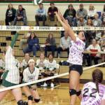 Sequims Jayla Julmist blocks a shot at the net against Port Angeles on Tuesday evening as teammate Tayler Breckenridge (22) is ready for a possible return. Julmist finished the match with seven blocks. Port Angeles players are McKenzie Musalek (4) and Jaida Wood (13). (Dave Logan /for Peninsula Daily News)
