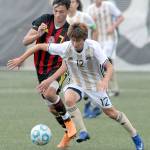 Keith Thorpe/Peninsula Daily News Peninsulas Hide Inoue, front, cuts off Skagit Valleys Cameron Orestad in the first half on Wednesday in Port Angeles.