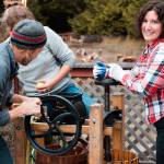 Cider Saloon attendees take part in traditional apple pressing at the 2017 Olympic Peninsula Apple Cider Festival in Port Townsend. (Jack Kingsley)