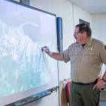 Clallam County Undersheriff Ron Cameron demonstrates how to use the smart board in the countys Emergency Operations Center on Monday. On Thursday, the county will participate in the Great Washington ShakeOut. (Jesse Major/Peninsula Daily News)