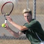 Keith Thorpe/Peninsula Daily News Port Angeles Hayden Woods takes aim in his singles match against Chimacums Jonah Diehl in September at Port Angeles High School.