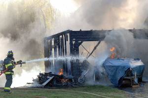 Port Angeles fire crews knock down blaze that endangered two homes