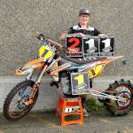 Port Angeles Jake Anstett with one of his uphill motorcycles and several of the trophies he has won this year hill climbing. Anstett was named the North American Hillclimbers Association Rider of the Year in 2018. (Pierre LaBossiere/Peninsula Daily News)